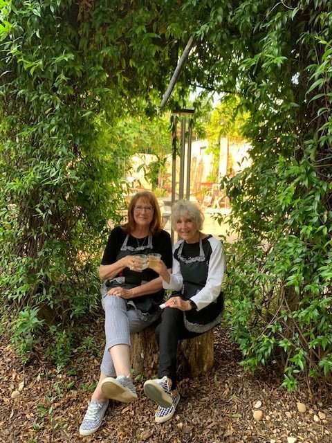 Pamela and Lindalee sitting outside